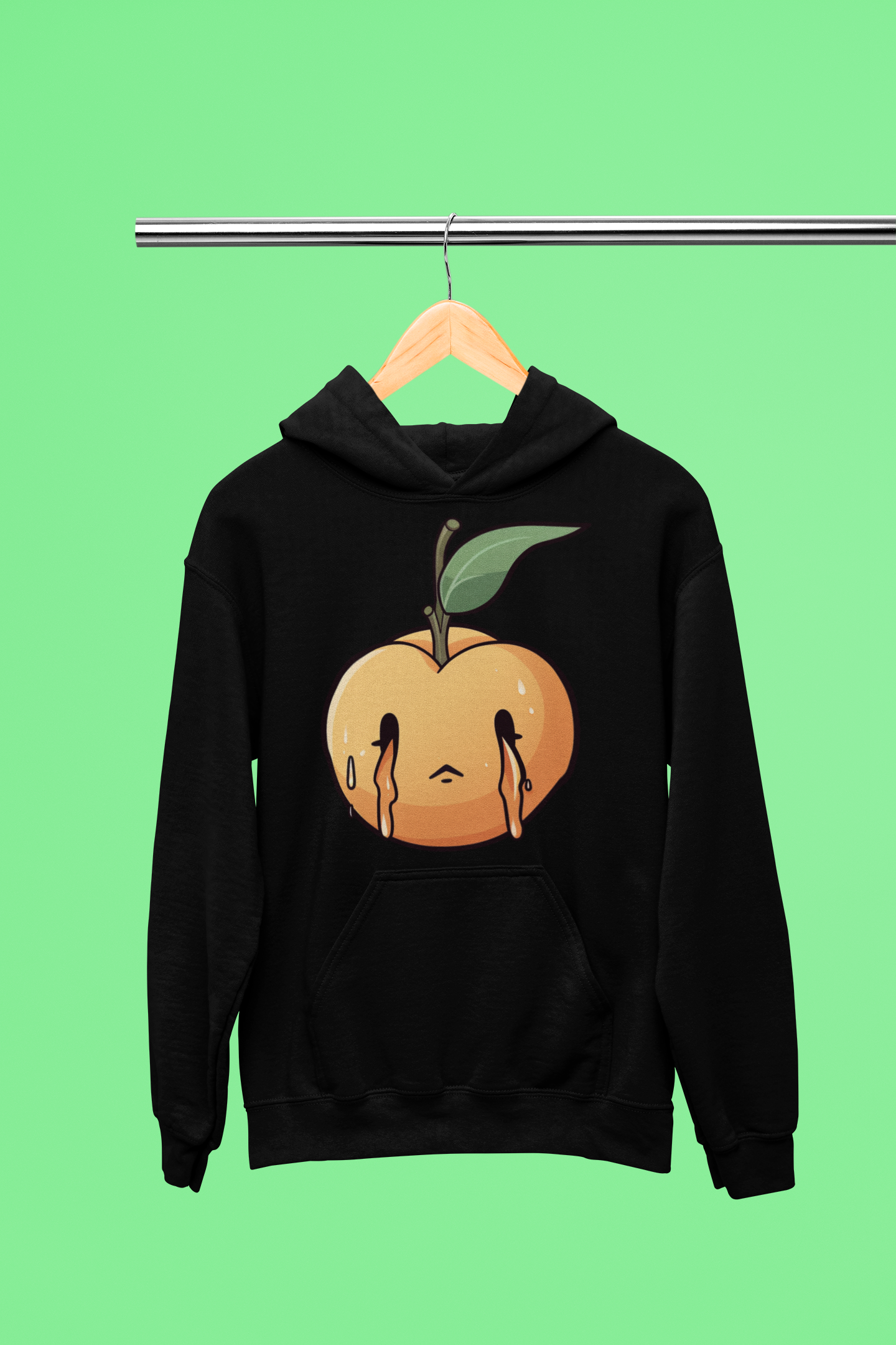 Black hoodie with a stylized peach graphic dripping with a sad face on a green background.