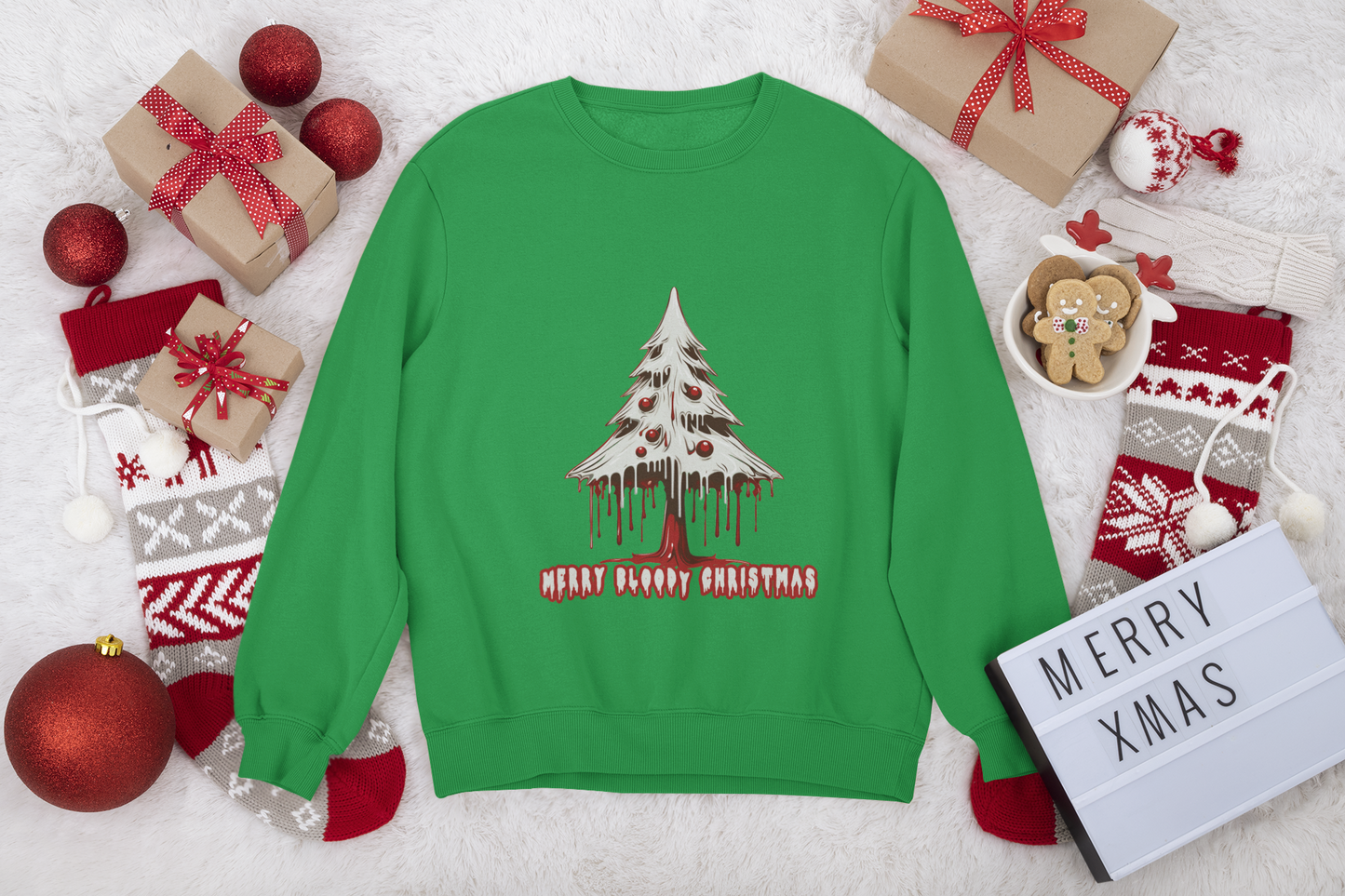 Green sweatshirt featuring a "Merry Bloody Christmas" tree graphic with holiday gifts and decorations around.