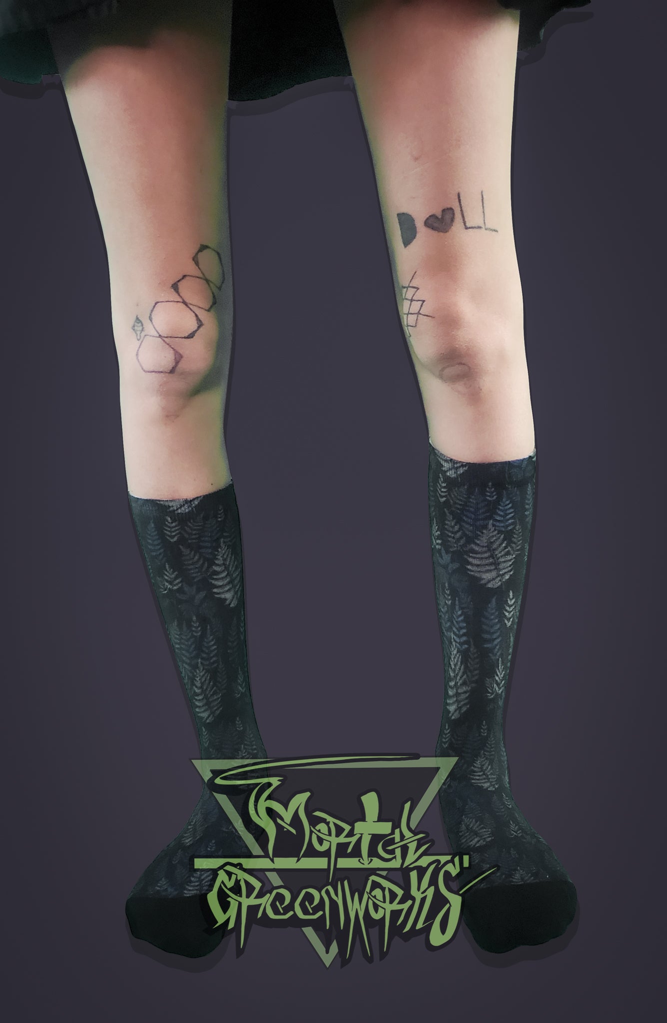 Person wearing black knee-high socks with purple and green floral patterns on a dark background