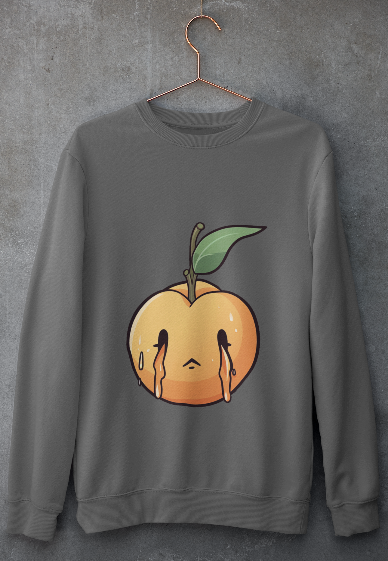 Charcoal sweatshirt with a melancholic cartoon peach character with a single green leaf.