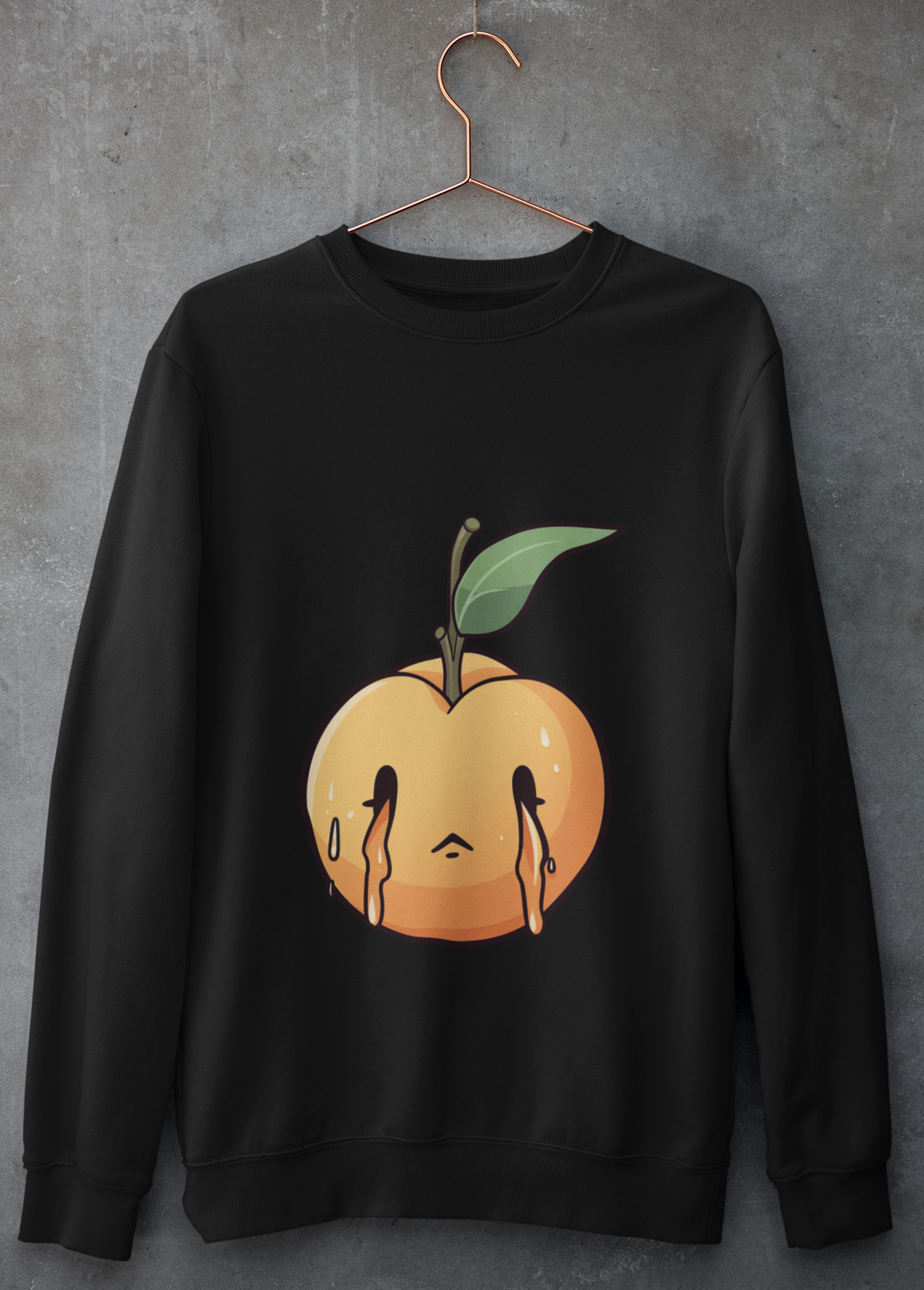 Black sweatshirt with a melancholic cartoon peach character with a single green leaf.