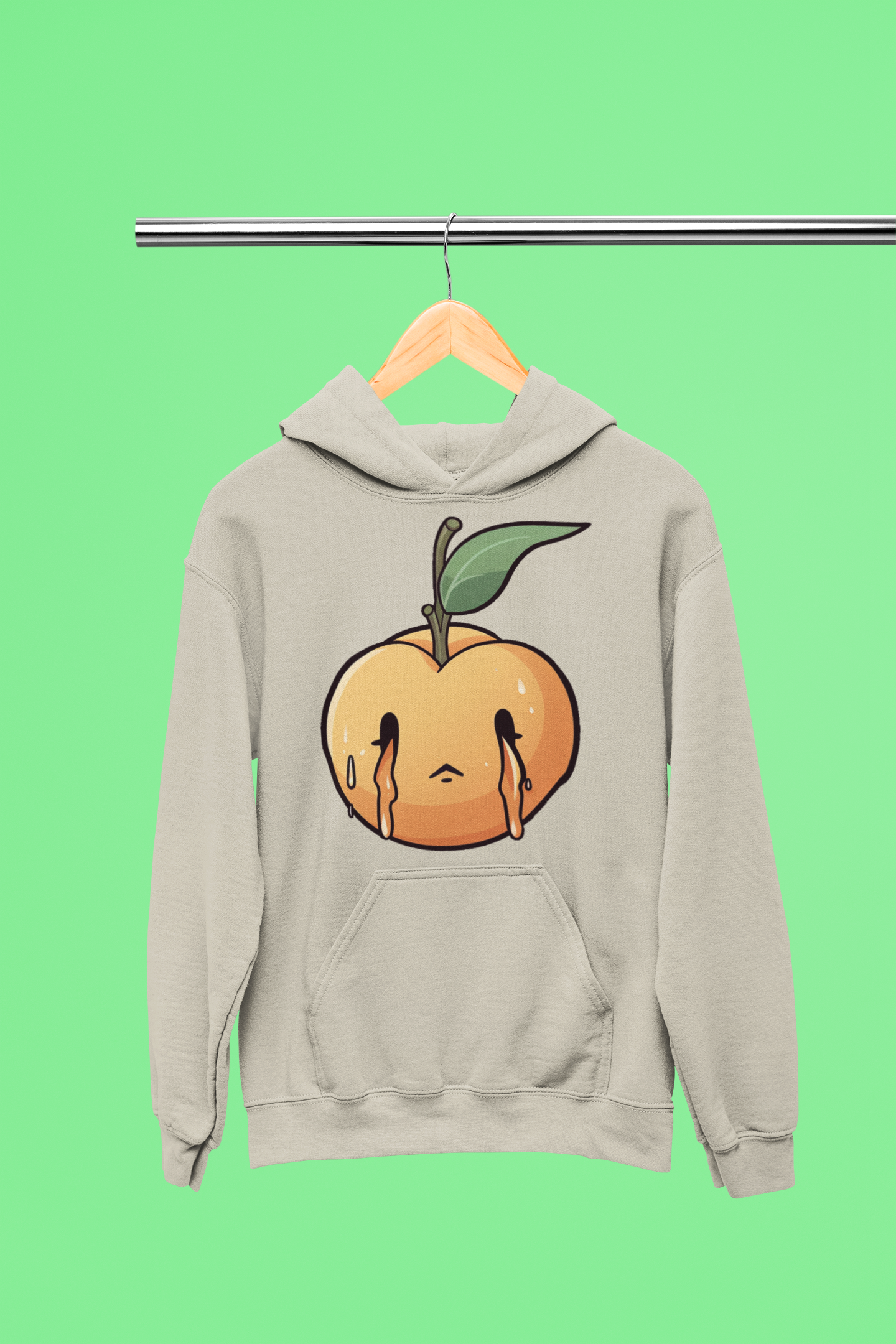 Oatmeal Heather hoodie on a hanger with a melting peach design on the front, displayed against a vibrant green background.