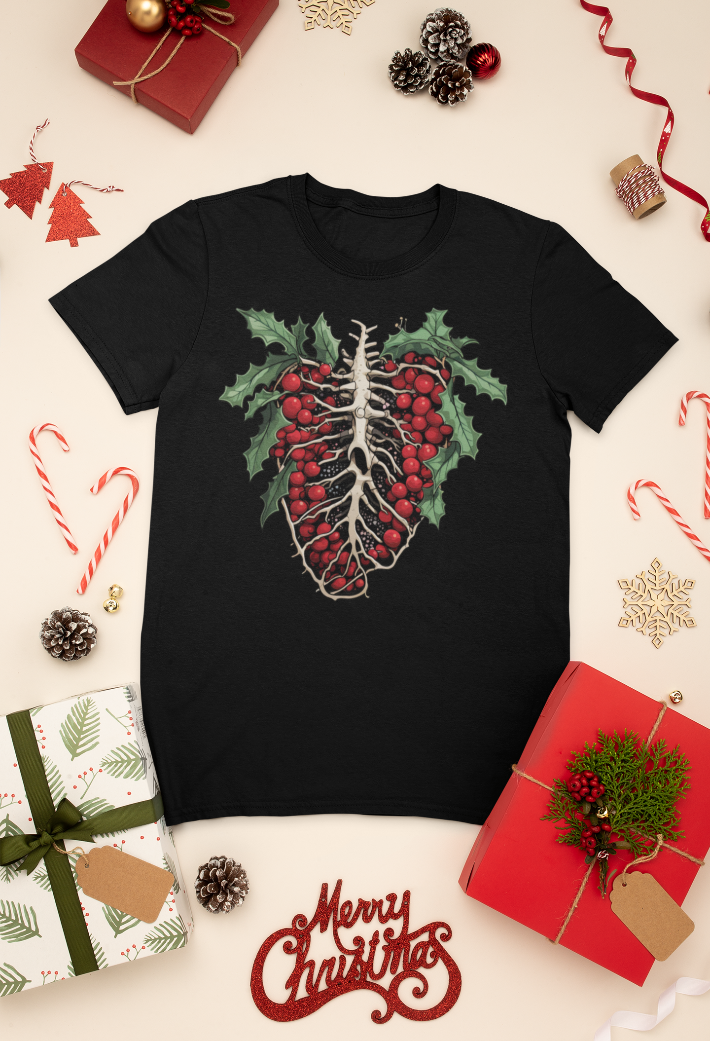 Black t-shirt flat lay featuring holly ribcage graphic, amidst Christmas decor and gifts, offering a spooky yet festive holiday apparel option.